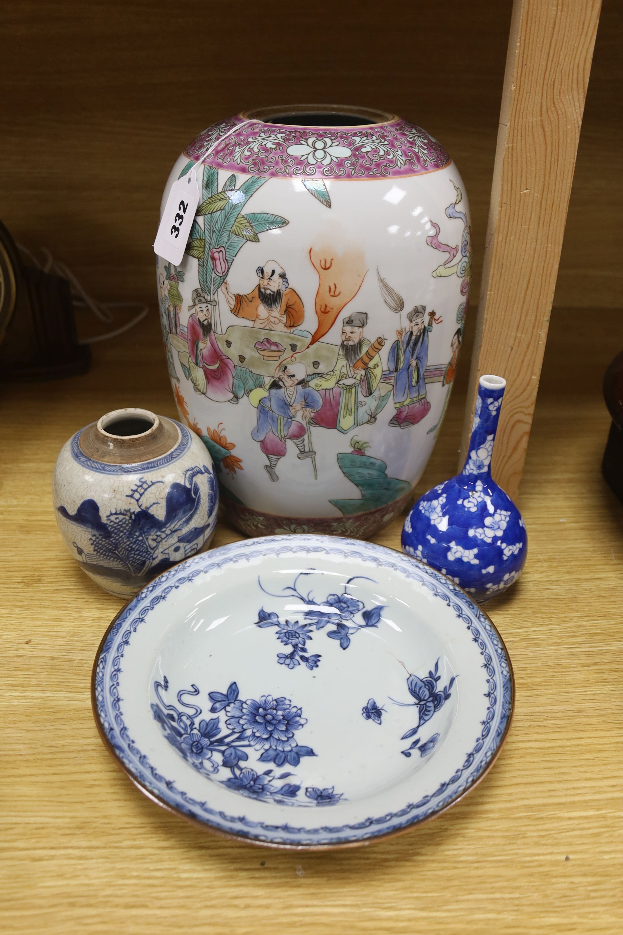 A Chinese blue and white dish, a bottle vase and jar, together with a famille rose jar lacking cover, height 29cm